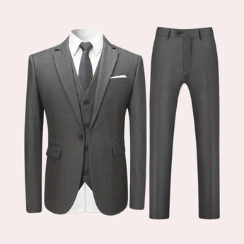 Men's gray slim fit blazer with a formal design, featuring a structured collar, full-length sleeves, and tailored fit, suitable for evening and party occasions.