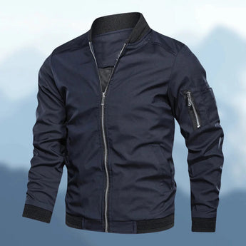 Men's slim fit navy lightweight bomber jacket with a zipper pocket, featuring a sleek design with a zip-up front, long sleeves, and a ribbed collar and cuffs, suitable for casual and stylish outerwear.