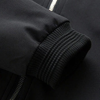 Men's navy slim fit lightweight bomber jacket featuring long sleeves, a zipper pocket, and a ribbed collar.