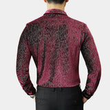 Men's slim fit shimmer shirt in a red to black gradient, designed for party wear, featuring long sleeves, a pointed collar, and a sleek fit. The shirt is styled on a model with a beard, showcasing its elegant yet modern look suitable for festive occasions.