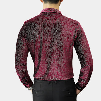 Men's slim fit shimmer shirt in a red to black gradient, designed for party wear, featuring long sleeves, a pointed collar, and a sleek fit. The shirt is styled on a model with a beard, showcasing its elegant yet modern look suitable for festive occasions.