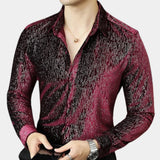 Men's slim fit shimmer shirt featuring a red to black gradient design, suitable for party wear. The shirt includes a collared neckline and long sleeves, worn by a model with a visible watch on the wrist, highlighting a confident gesture.