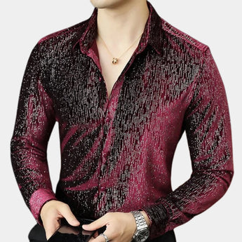 Men's slim fit shimmer shirt featuring a red to black gradient design, suitable for party wear. The shirt includes a collared neckline and long sleeves, worn by a model with a visible watch on the wrist, highlighting a confident gesture.