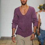 
A man wearing a purple slim fit V-neck thermal knit sweater in an earth tone, showcasing its stylish design with long sleeves and a snug fit around the waist.