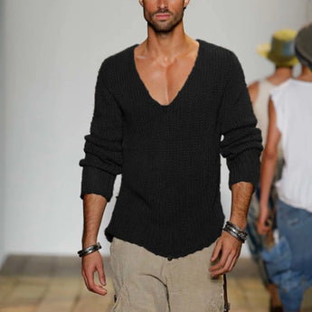 
A man wearing a black slim fit V-neck thermal knit sweater in an XL size, showcasing the earth tone design. The sweater features long sleeves and is styled for a fitted appearance.
