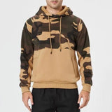 Men's tactical camouflage hoodie in green camo pattern, featuring a full sleeve design with a high collar, shown on a human model displaying the upper body and arms, suitable for hunting and outdoor activities.