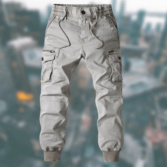Men's gray tactical cargo pants in size 3XL, featuring a durable, water-resistant fabric with multiple pockets, shown on a model against a neutral background.