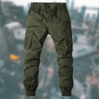 Men's army green tactical cargo pants in size 3XL, featuring multiple pockets and durable, water-resistant material with a camouflage pattern, designed for rugged outdoor use.