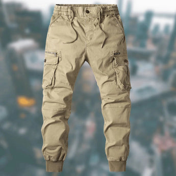 Men's khaki tactical cargo pants in size 3XL, featuring a durable and water-resistant fabric with multiple pockets, modeled on a human body.
