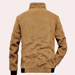 Men's tan corduroy jacket with ribbed cuffs and a high collar, featuring a textured fabric and classic outerwear style.