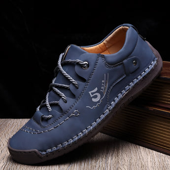 Men's tan leather sneakers featuring hand-stitched details, designed for durability and breathability, with blue accents and available in size 46.