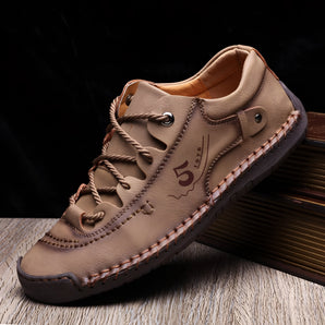 Men's tan leather sneakers with hand-stitched detailing, showcasing a durable and breathable design, suitable for outdoor walking and casual wear.