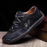 Men's black leather sneakers with hand-stitched detailing, designed for durability and breathability, shown in size 46.