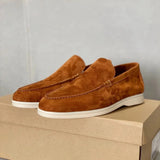 Men's tan suede loafers featuring a comfortable slip-on design with contrast stitching, shown in an orange shade and size 47.