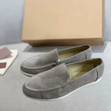 Men's tan suede loafers featuring comfortable slip-on design, contrast stitching, and leather construction, displayed in light gray size 47.