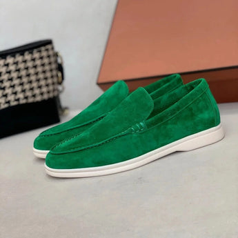 Men's tan suede loafers featuring contrast stitching, designed for comfort with a slip-on style.