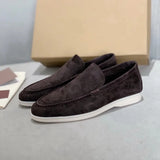 Men's tan suede loafers in brown, featuring a comfortable slip-on design with contrast stitching and a synthetic rubber sole.