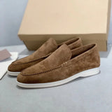 Men's light brown suede loafers featuring comfortable slip-on design, contrast stitching, and a synthetic rubber sole.