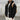 Men's tan teddy bear hoodie in faux fur fabric, featuring a zip-up front and fleece material. The hoodie includes a collar, sleeves, and waist that contribute to its cozy design. Displayed in a black color variant, size XL.