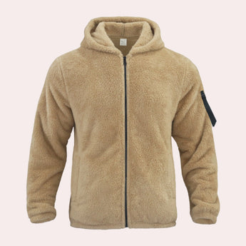 Men's tan teddy bear hoodie made of faux fur, featuring a zip-up front, long sleeves, and a cozy collar. The jacket includes pockets and has a warm, fleece texture in a beige color.