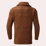 Men's thick brown turtleneck cable knit sweater featuring a cozy design with intricate knit patterns, ideal for winter wear.