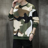 Men's oversized streetwear pullover sweatshirt in a green camouflage pattern, featuring long sleeves and a relaxed fit.