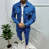 Men's tracksuit in a two-tone blue design, featuring a jacket with a collar and long sleeves, paired with matching pants. The tracksuit is displayed in a stylish urban setting, emphasizing its lightweight and comfortable fit. The color is described as a blue sapphire, and the size is 3XL.