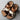 Men's brown two-tone leather sandals with adjustable strap and cork sole, size 47, displayed on a wooden surface.
