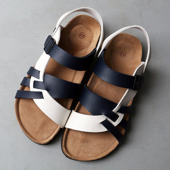 Men's two-tone leather sandals with adjustable strap and cork sole, featuring a beige color scheme.