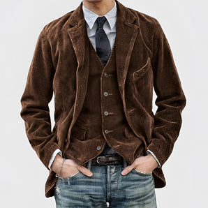 Men's vintage brown slim fit corduroy blazer in 3XL displayed on a hanger, showcasing its elegant design, long sleeves, and classic collar suitable for fall fashion.