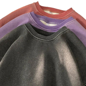 Men's vintage wash charcoal crew neck sweatshirt in a relaxed fit, featuring long sleeves and a classic collar design with a subtle grey tint.