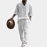 Men's white cable-knit hoodie and pants set in extra-large size, featuring cozy winter knitwear design with long sleeves and a relaxed fit.