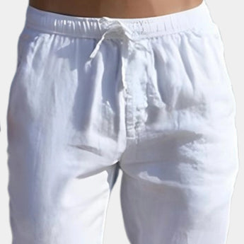 Men's white linen pants with an elastic waist, lightweight and breathable fabric, displayed against a light background.
