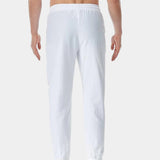 Men's white linen pants showcasing a lightweight and breathable fabric design, with an elastic waist for comfort and flexibility.