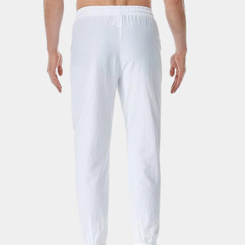 Men's white linen pants showcasing a lightweight and breathable fabric design, with an elastic waist for comfort and flexibility.