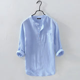 Men's blue 4XL linen shirt on a clothes hanger, featuring a collar and sleeves, displayed on a light background.