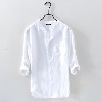 Men's white linen shirt on a clothes hanger, featuring a classic collar and long sleeves, designed for casual wear with a lightweight and breathable fabric.