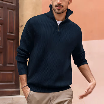 Men's white ribbed half-zip sweater with a casual and lightweight design, featuring long sleeves and a high collar. The sweater is being worn by a model with a beard, showcasing the fit and texture of the knitwear around the shoulders and neck.