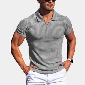 Men's white slim fit stretch cotton polo shirt in light gray, size 2XL, worn by a muscular individual with a watch on their arm.