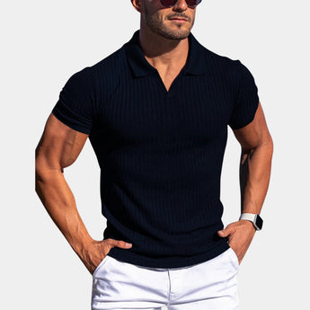 Men's slim fit black polo shirt in a large 2XL size, featuring a stretch cotton fabric for athletic and breathable wear. The shirt showcases a neatly collared neck and short sleeves, with a model wearing sunglasses and a watch, highlighting a casual yet stylish look.