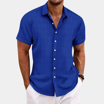 Men's short sleeve dress shirt in blue with white stripes, featuring a comfortable cotton fabric suited for summer wear; model wearing the shirt in size XXL, with an arm showing a wristwatch.