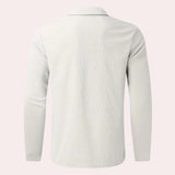 Men's white long sleeve polo shirt with a zipper collar, featuring a lightweight and casual design.