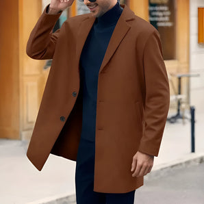 Men's double-breasted wool blend brown overcoat in XXL, featuring a formal design with a classic collar and long sleeves. The model is standing, showcasing the coat's elegant fit and style.