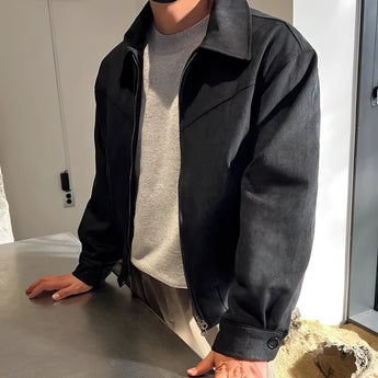Black suede bomber jacket for men, featuring long sleeves, a collar, and a lightweight design suitable for urban fall fashion, layered over a white dress shirt.
