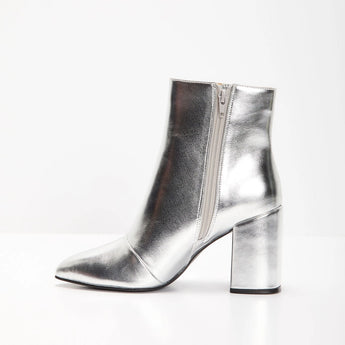 Metallic silver high heel ankle boots with a trendy fashion design, featuring a sleek silhouette and stylish appearance, perfect for making a fashion statement at any event.