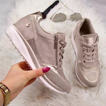 Metallic silver platform sneakers in women's size 43 featuring a trendy and fashionable design with gold accents, suitable for outdoor and casual wear.