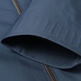 Minimalist dark blue men's bomber jacket with a sleek design, featuring a collar and long sleeves, showcasing a lightweight urban fashion style.