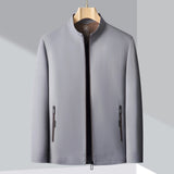 Men's minimalist bomber jacket in dark blue, featuring a lightweight design with long sleeves, a collar, and button details, suitable for urban fashion.