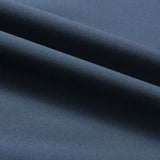 Minimalist dark blue men's bomber jacket displayed on a mannequin, showcasing its lightweight design and urban fashion style. The jacket features a sleek, electric blue hue with subtle patterns, creating a modern and stylish look against a neutral grey background.