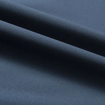 Minimalist dark blue men's bomber jacket displayed on a mannequin, showcasing its lightweight design and urban fashion style. The jacket features a sleek, electric blue hue with subtle patterns, creating a modern and stylish look against a neutral grey background.